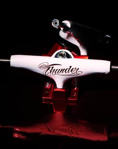 Thunder Skateboard Trucks Flash Hollow Lights White/Red 147