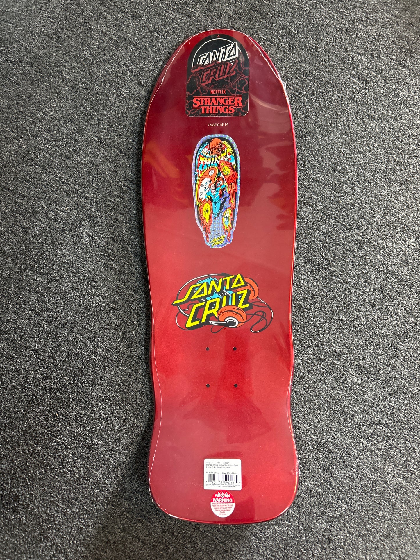 Santa Cruz X Stranger Things 9.7” deck Grabke Max Melting Clock GLOW IN THE DARK