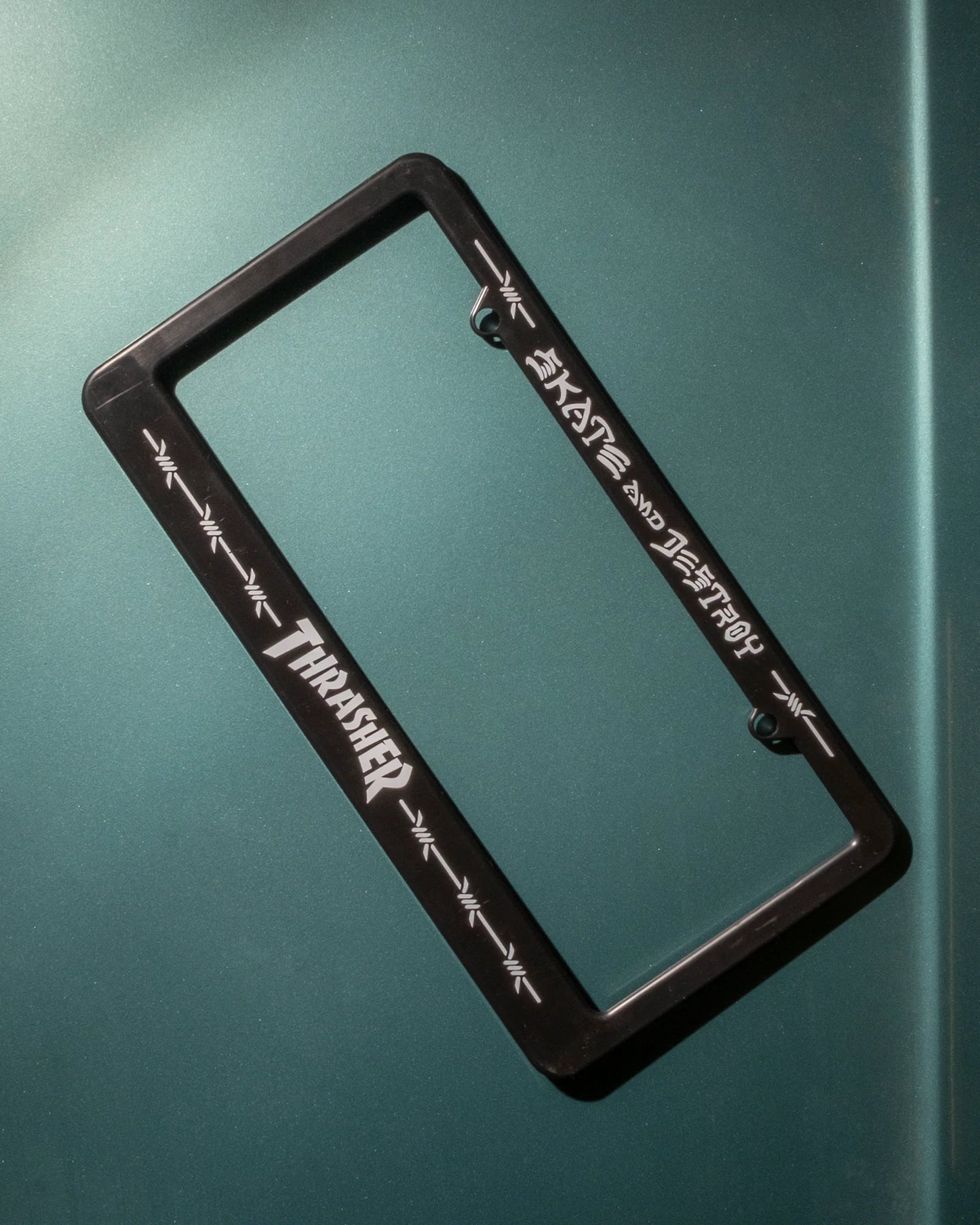 THRASHER BARBED WIRE LICENSE PLATE HOLDER