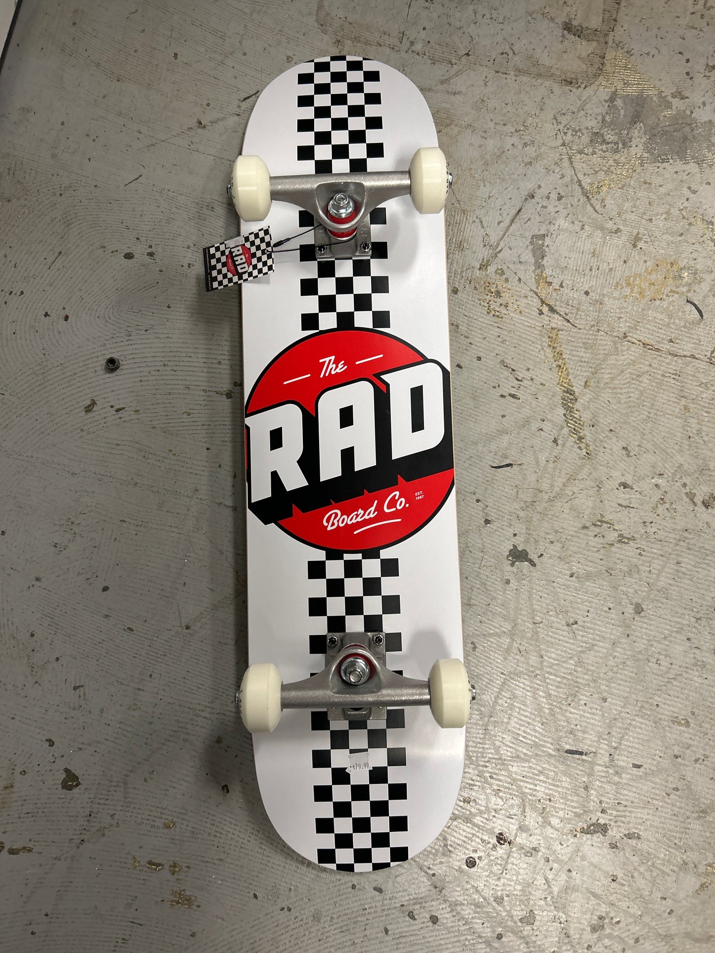 Rad 7.75 complete skateboard.   White checker stripe