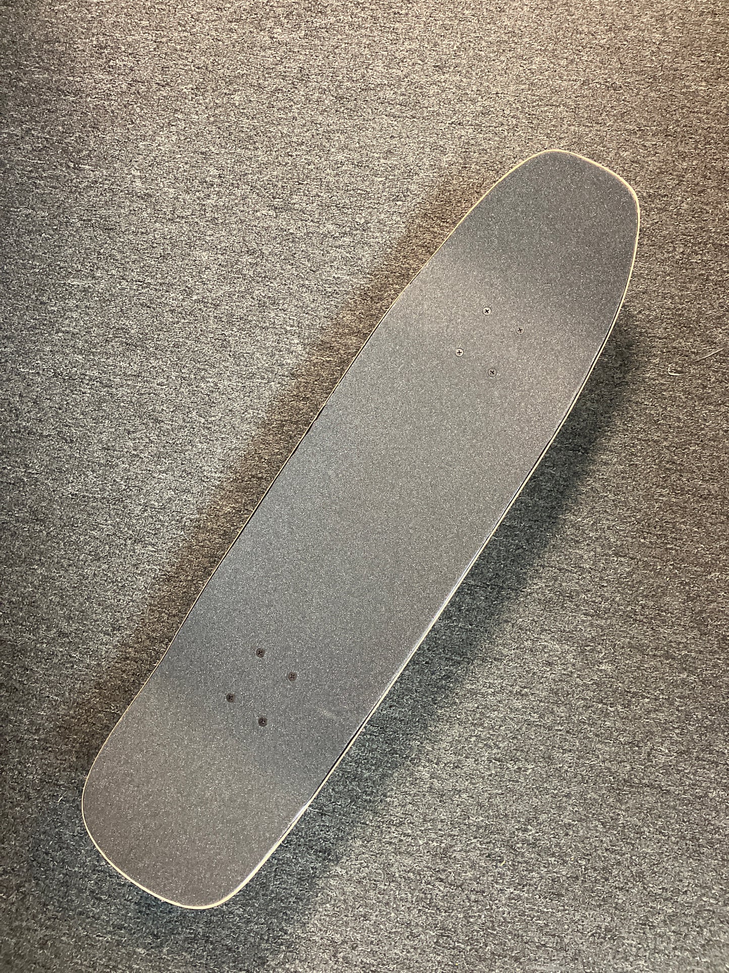 Madrid Complete Skateboard Texas Chainsaw Massacre 9”x33.5” pool shape with Tensor Trucks & green Slimeball light up wheels.