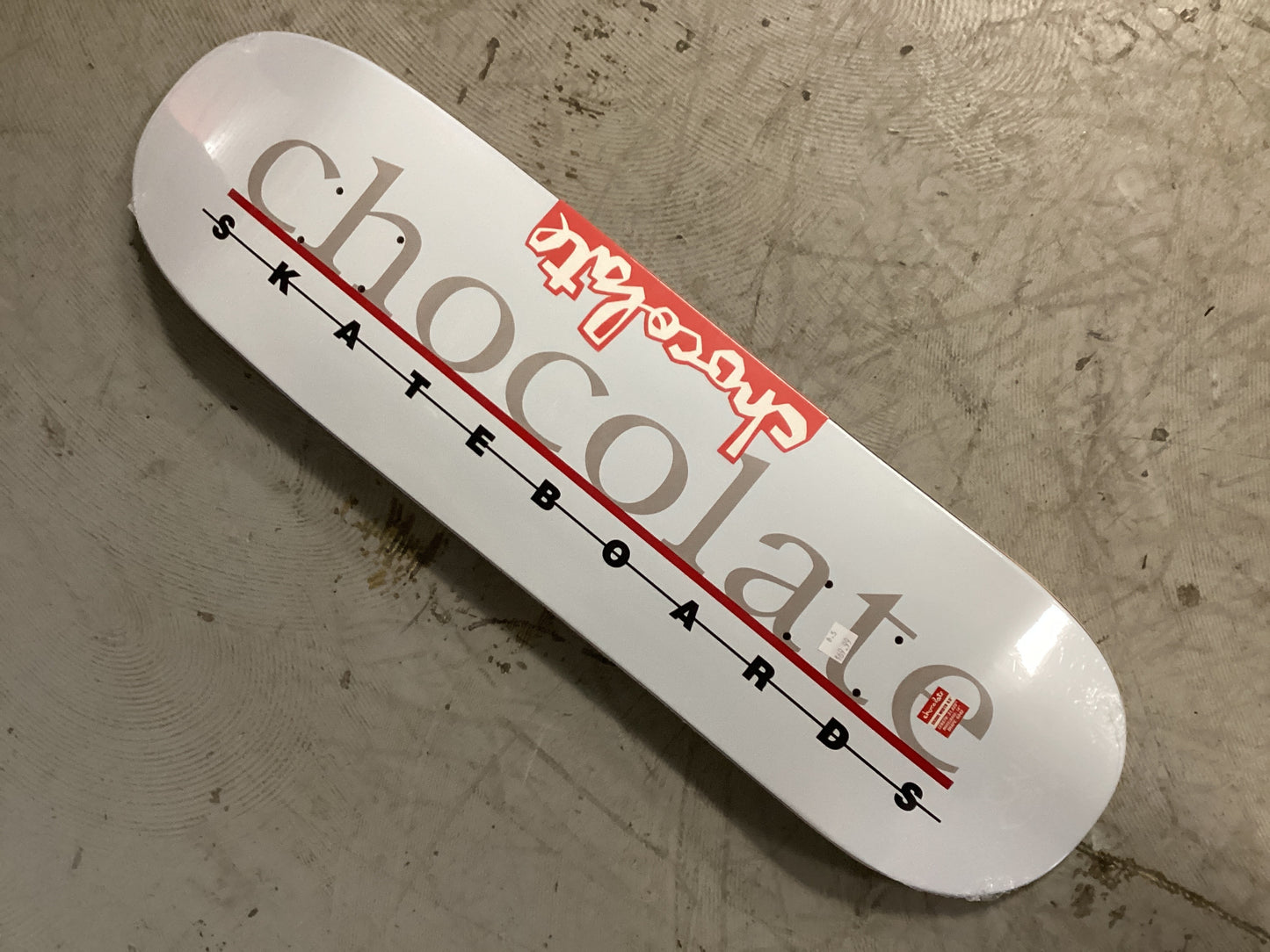 Chocolate 8.5 deck shaped Anderson the bar logo