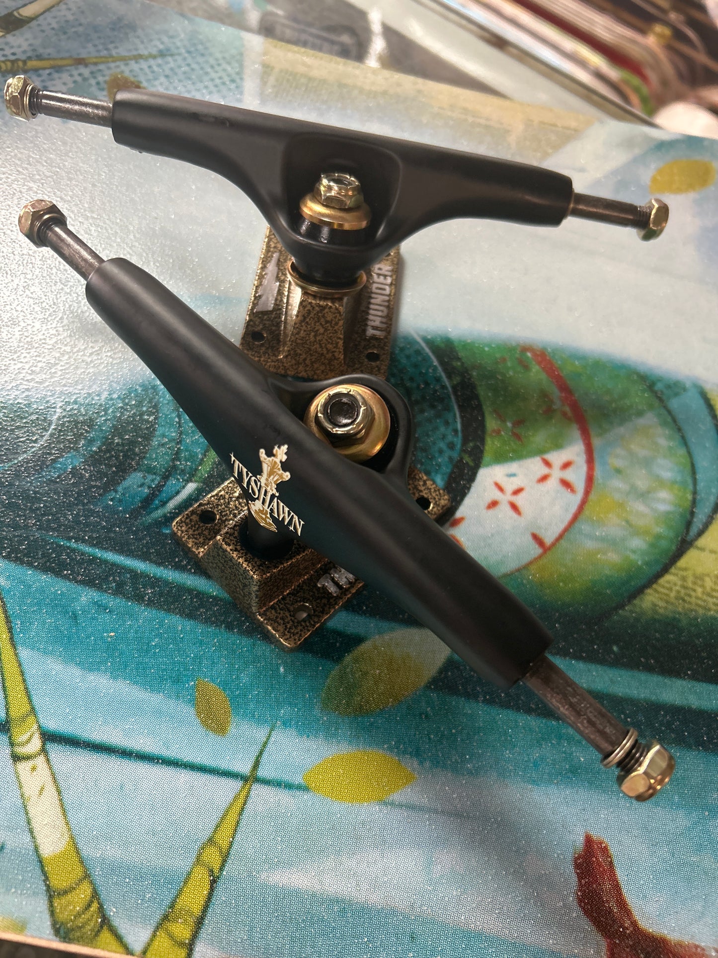 Thunder 148 Trucks set Jones Pro Endgame black gold