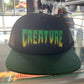 Creature Logo Black/Green Trucker Hat Mesh